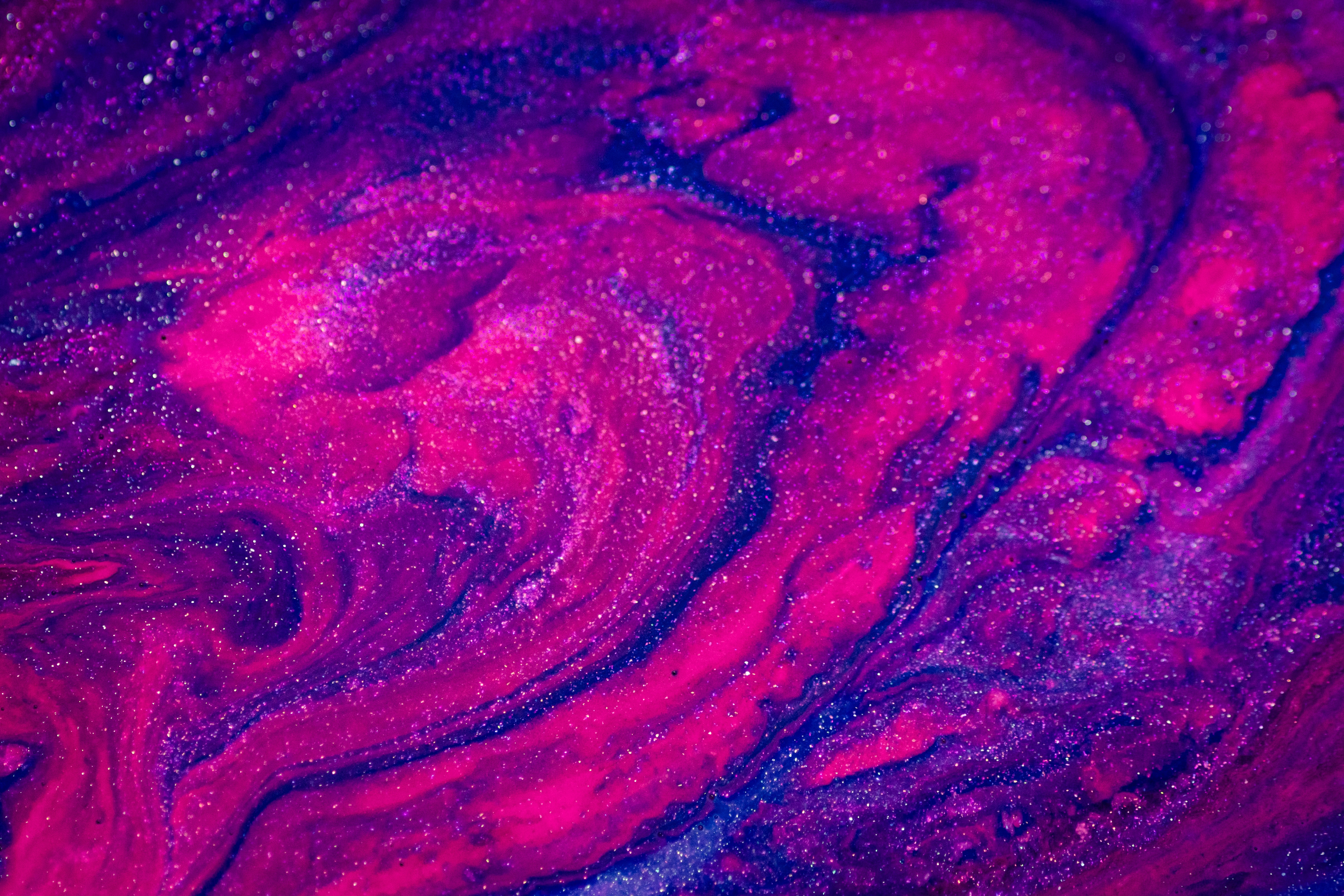 Photo of a purple and pink glittery mess of paint, resembling something celestial.